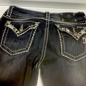 Miss Me black denim jeans.  Some of the rhinestones are loose.